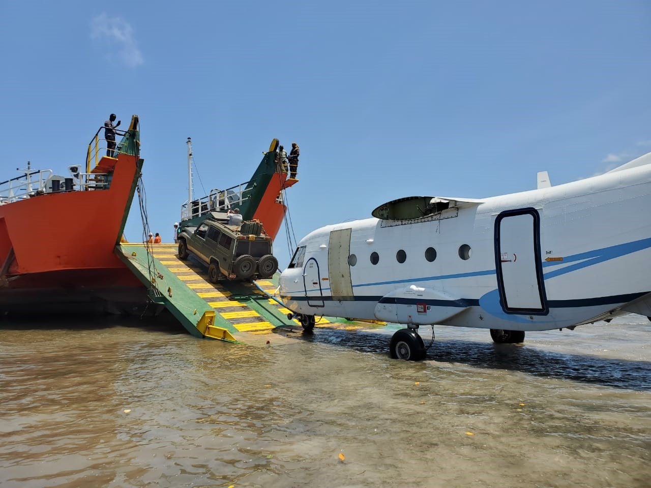 Landing craft and aircraft during a remote logistics operation